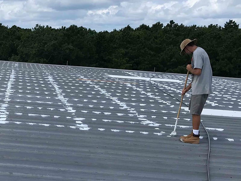 AP-2300 Acrylic Mastic Roof Penetration Repair in Progress